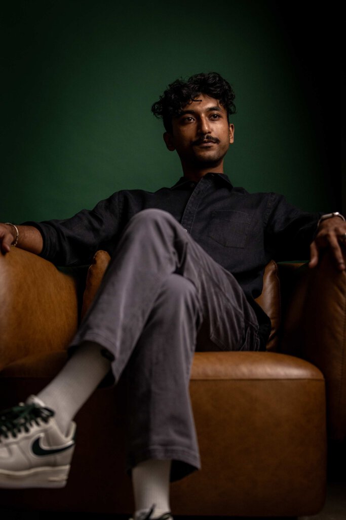 Man sitting in leather chair and looking past the camera