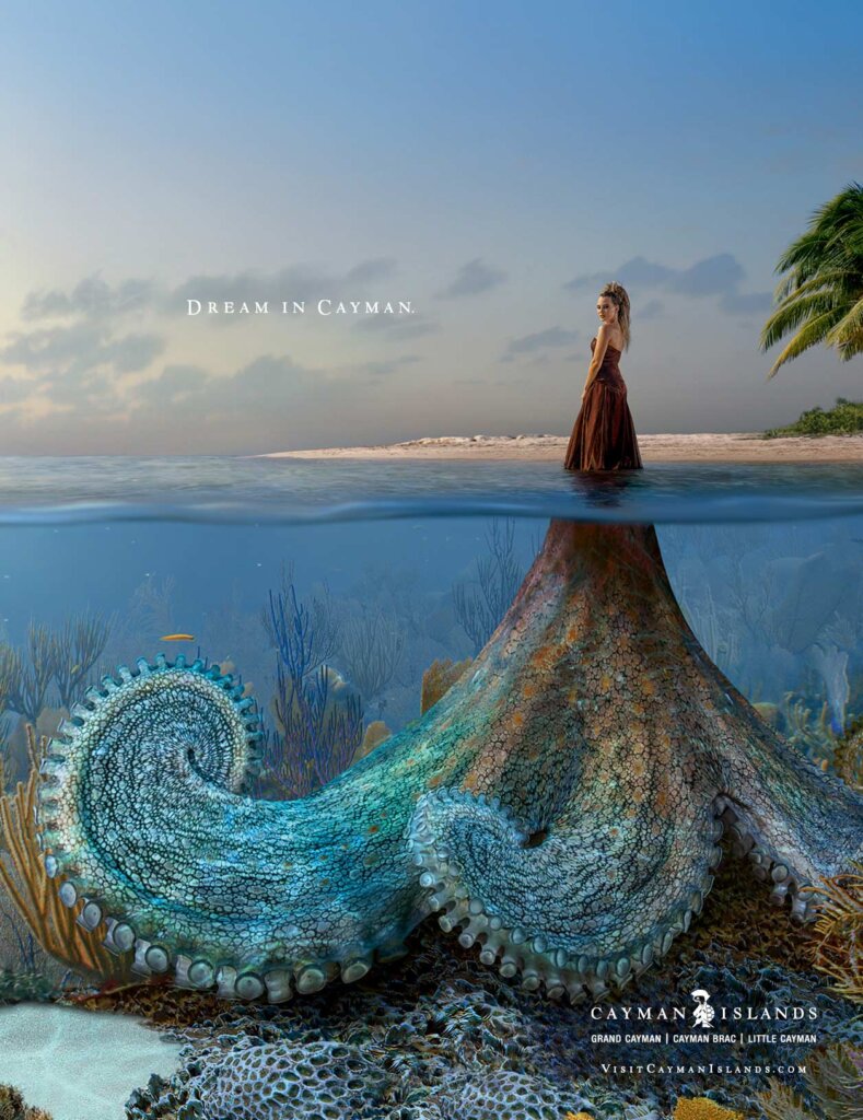 Cayman Islands: Woman standing in sea with dress like octopus below the surface